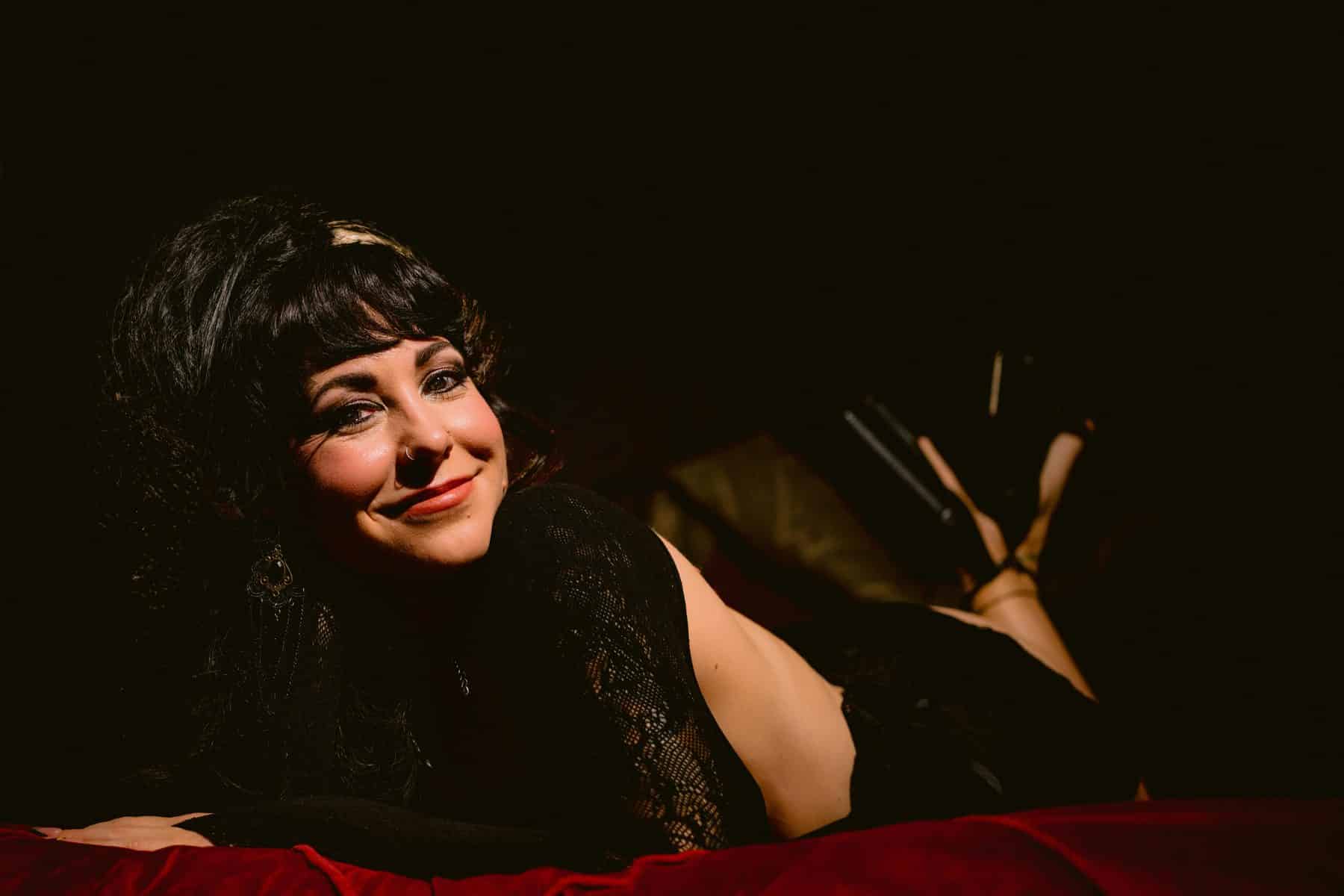 Cute and sexy boudoir on red velvet set with handmade black lace lingerie

