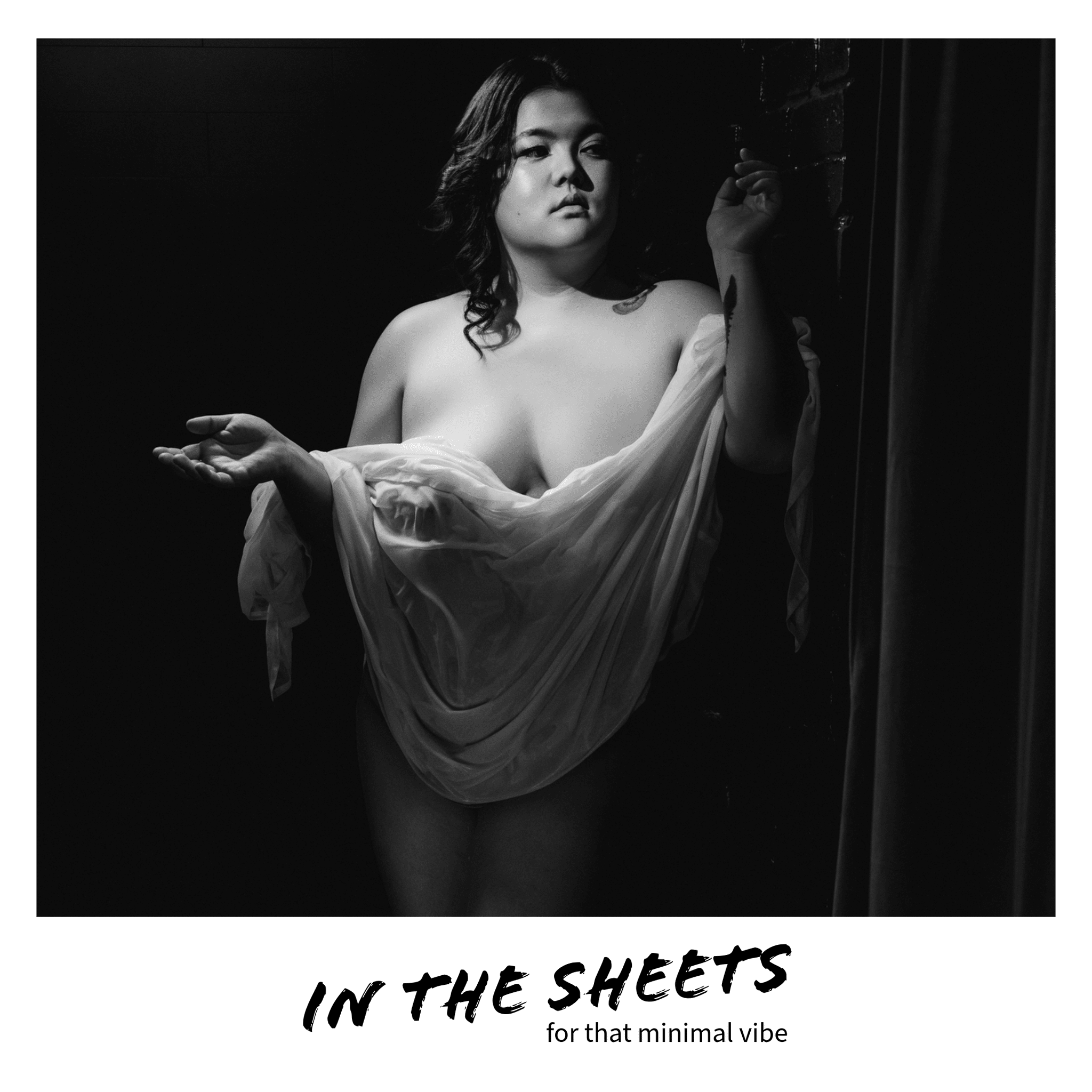 Boudoir photo of just sheets, nude, implied nude