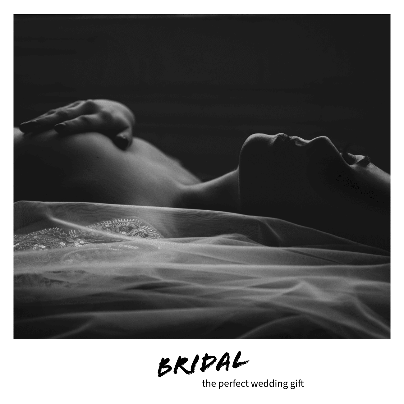 Moody black and white bridal boudoir photo with veil, topless